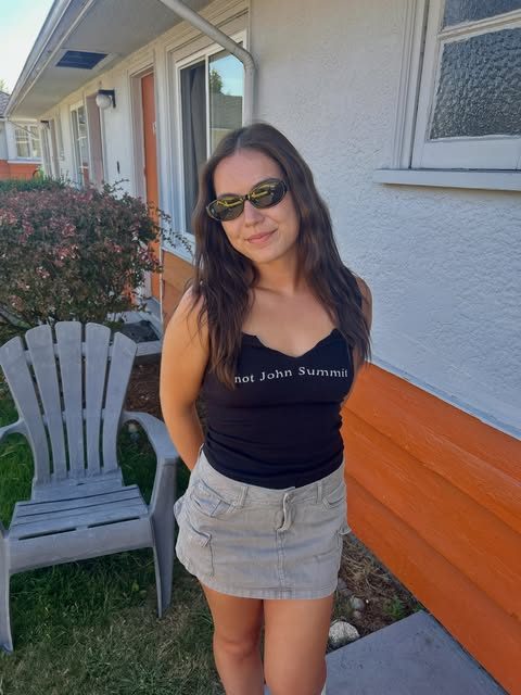 Client outdoors showing off a natural-looking sunless tan